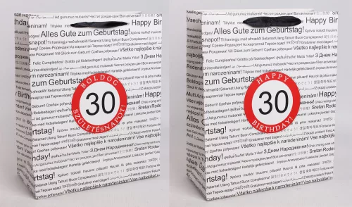 PAPÍRTASAK MATT, SZALAG FÜLLEL, FEHÉR ALAPON FEKETE, TÖBBFÉLE NEMZETKÖZI NYELVEN HAPPY BIRTHDAY FELIRATTAL A HÁTTÉRBEN, PIROS KARIKÁBAN ÉVSZÁMMAL, 30